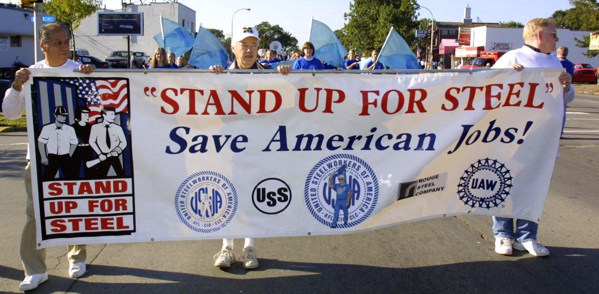 Michigan steelworkers rally to urge President Bush to defend manufacturing jobs by keeping steel tariffs in place in River Rouge, Michigan on September 20, 2003 (Bill Pugliano/Getty Images)