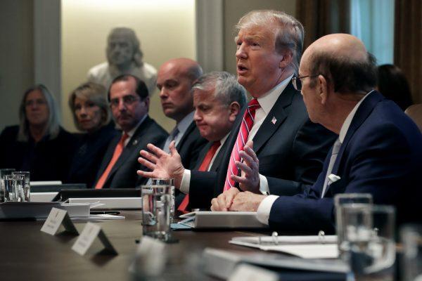 President Donald Trump talks to reporters during a meeting of his cabinet in the Cabinet Room at the White House in Washington on Feb. 12, 2019. (Chip Somodevilla/Getty Images)