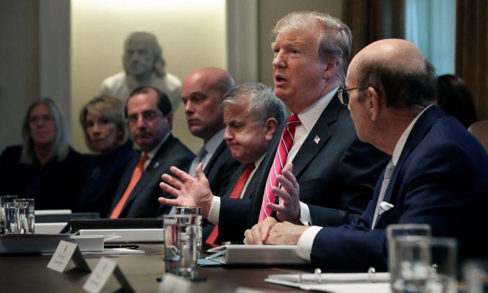 President Donald Trump talks to reporters during a meeting of his cabinet in the Cabinet Room at the White House in Washington on Feb. 12, 2019. (Chip Somodevilla/Getty Images)