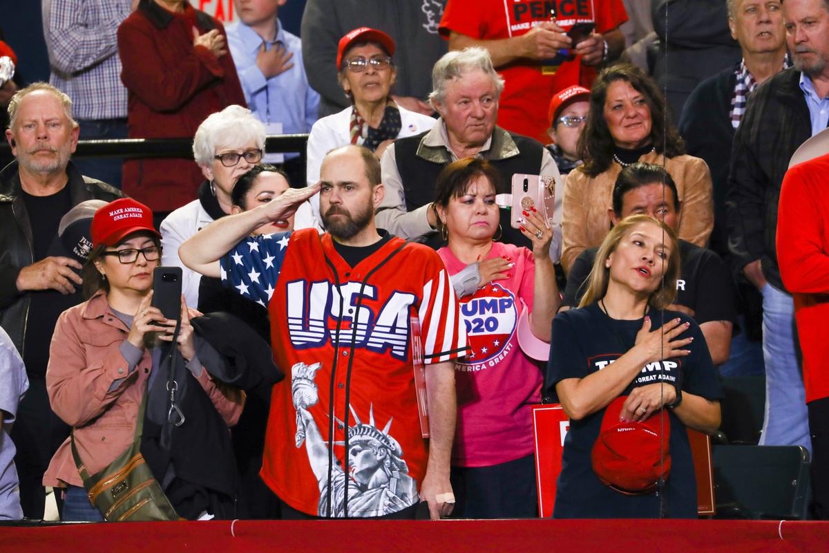 Attendees sing the national anthem at the Make America Great Again rally in El Paso, Texas, on Feb. 11, 2019. (Charlotte Cuthbertson/The Epoch Times)
