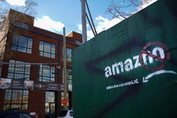 A protest message directed at Amazon is spray painted on a wall near a construction site in the Long Island City neighborhood of the Queens borough of New York City, on January 9, 2019.(Photo by Drew Angerer/Getty Images)