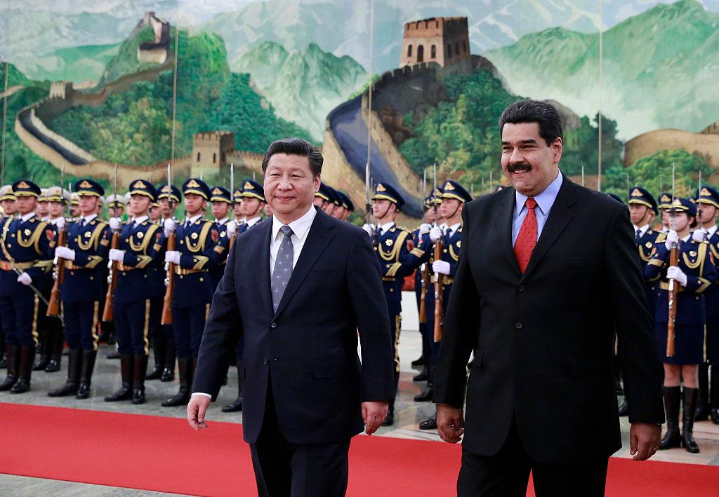 Venezuela's President Nicolas Maduro (R) walks with Chinese leader Xi Jinping as they arrive to a welcoming ceremony at the Great Hall of the People in Beijing on Jan. 7, 2015. (Andy Wong-Pool/Getty Images)