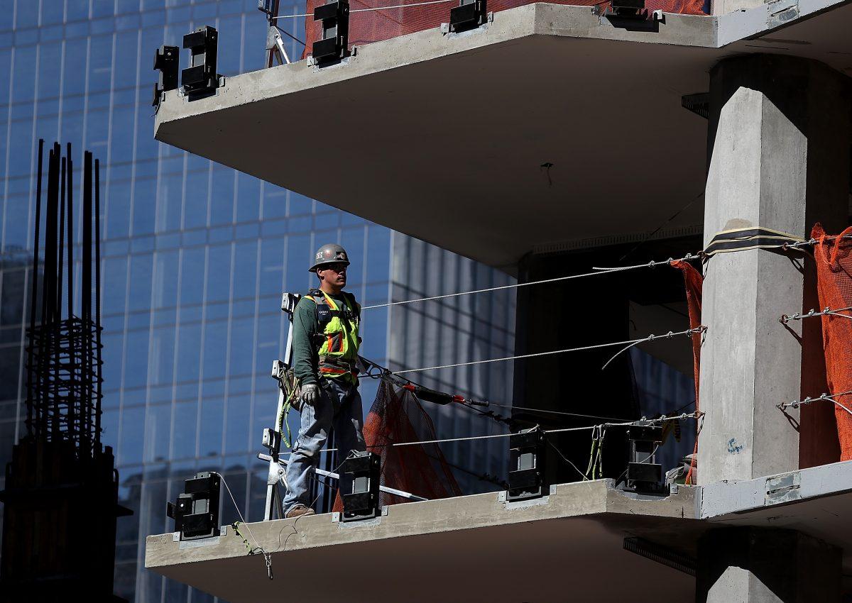 A construction worker stands on a floor of a building under construction in San Francisco on Oct. 5, 2018. (Justin Sullivan/Getty Images)