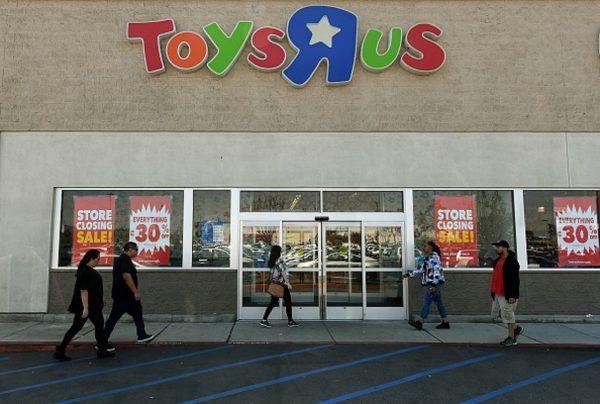 Customers shop at a Toys 'R' Us store, the iconic retail chain after it announced plans to shut all of its US stores, becoming one of the biggest casualties of the retail shakeout amid the rise of e-commerce, in Los Angeles, on March 23, 2018. (Mark Ralston/AFP/Getty Images)
