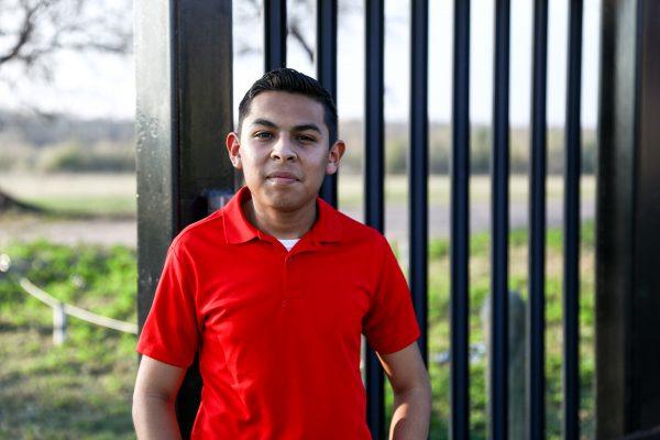 Freddy Arellano stands by the fence a few hundred yards from the Rio Grande in Eagle Pass, Texas, on Feb. 6, 2019. (Charlotte Cuthbertson/The Epoch Times)