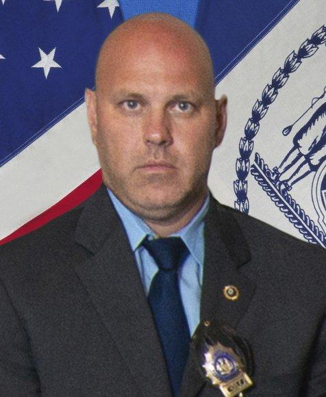 In this undated photo provided by the New York City Police Department, Det. Brian Simonsen is shown. (New York City Police Department via AP)