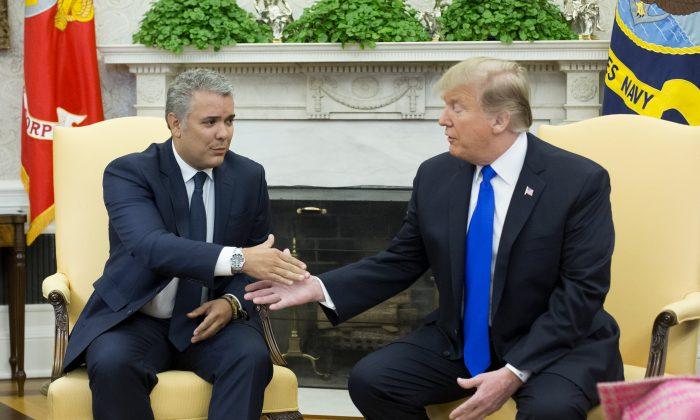 President Donald J. Trump meets with the President of Colombia Ivan Duque in the Oval Office of the White House, on Feb. 13, 2019. (Michael Reynolds-Pool/Getty Images)