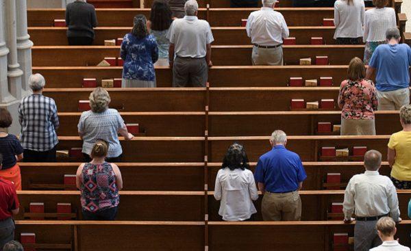 Parishioners worship during a mass to celebrate the Assumption of the Blessed Virgin Mary at St Paul Cathedral, the mother church of the Pittsburgh Diocese, in Pittsburgh, Pennsylvania, on Aug. 15, 2018. (Jeff Swensen/Getty Images)