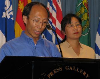 File photo of Former Falun Gong prisoner of conscience He Lizhi speaking at a press conference on Parliament Hill in Ottawa. To the right is Lucy Zhou, spokesperson for the Falun Dafa Association of Canada. (Donna He/The Epoch Times)