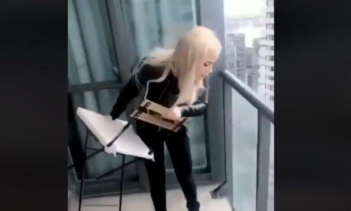 Woman Arrested After Video Shows Her Tossing a Chair From Balcony Onto Highway