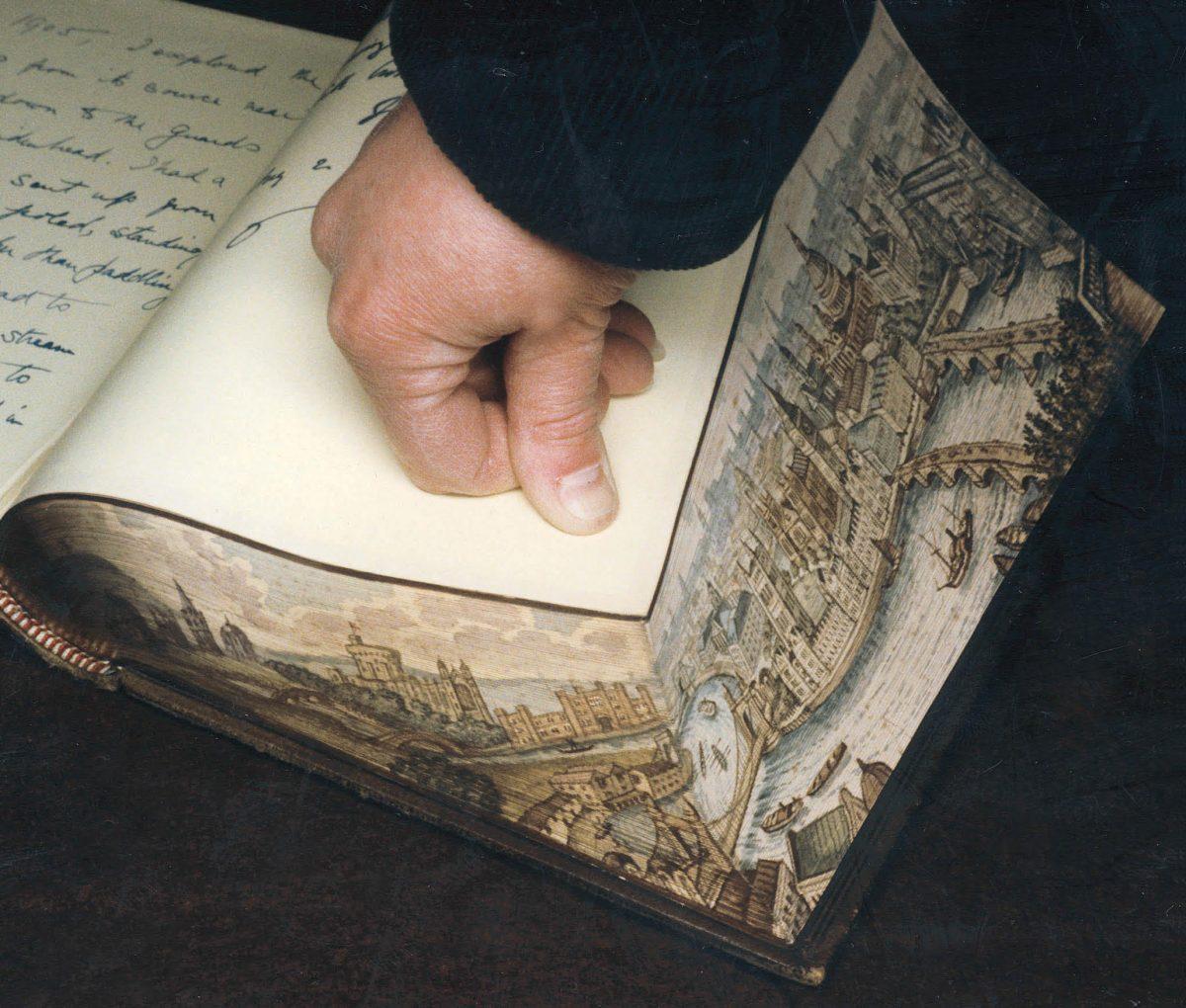 Fore-edge painter Martin Frost paints scenes on the edges of books, a skill critically endangered in the UK. (Foredgefrost)