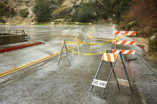 The California State Parks service has closed the Highway 49 parking lot at the South Yuba River Bridge in anticipation of rock and mud slides that are prone to the area during periods of heavy rainfall in Nevada City, Calif., on Feb. 13, 2019. (Elias Funez/The Union via AP)