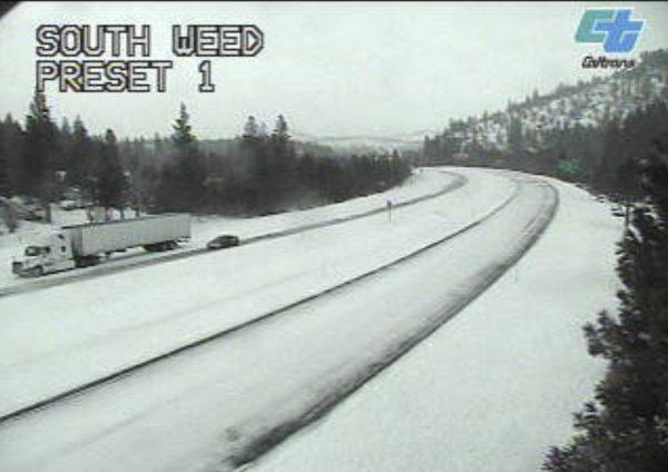 This image from a Caltrans traffic camera shows snow on Interstate 5 in Weed, Calif., on Feb. 13, 2019. (Caltrans via AP)