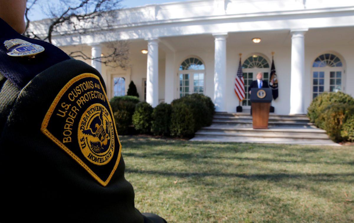 A U.S. Border Patrol agent listens from the front row as President Donald Trump declares a national emergenc, in the Rose Garden of the White House in Washington, Feb. 15, 2019. (REUTERS/Carlos Barria)