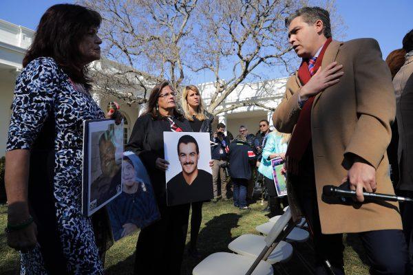 CNN's Jim Acosta (R) talks with 'Angel moms,' including Sabine Durden (L), following a news conference with U.S. President Donald Trump in the Rose Garden at the White House Feb. 15, 2019 in Washington. (Chip Somodevilla/Getty Images)