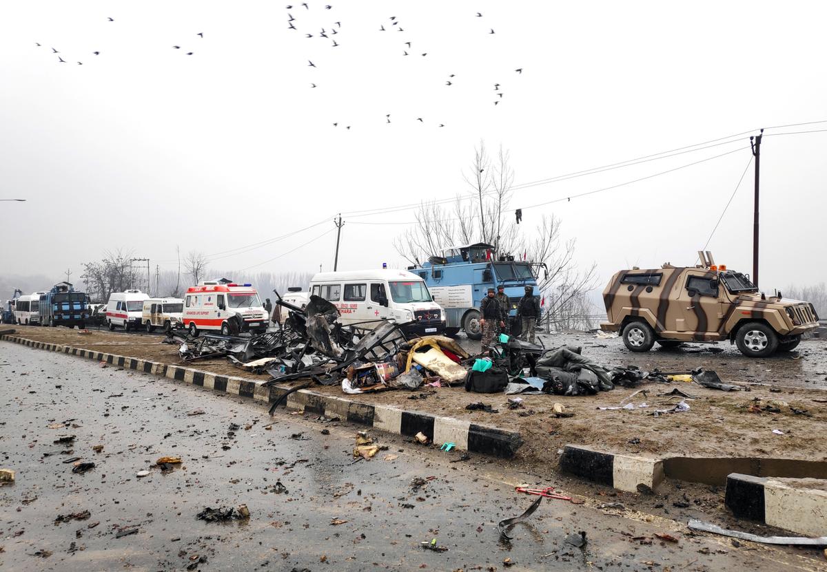 Indian soldiers examine the debris after an explosion in Lethpora in south Kashmir's Pulwama district Feb. 14, 2019. (Younis Khaliq/Reuters)