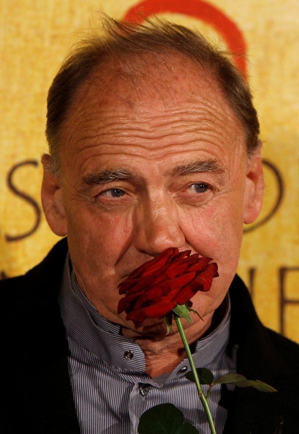 Swiss actor Bruno Ganz poses with a rose during his arrival for the German film premiere of the film "Das Ende ist mein Anfang" (The end is my beginning) in Munich, Germany, on Oct. 5, 2010. (Michaela Rehle/File Photo/Reuters)