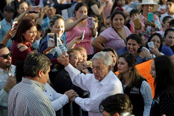 Mexico's President Andres Manuel Lopez Obrador greets people during his arrival to an event in Badiraguato, in the Mexican state of Sinaloa, Mexico, on Feb. 15, 2019. (Daniel Becerril/Reuters)