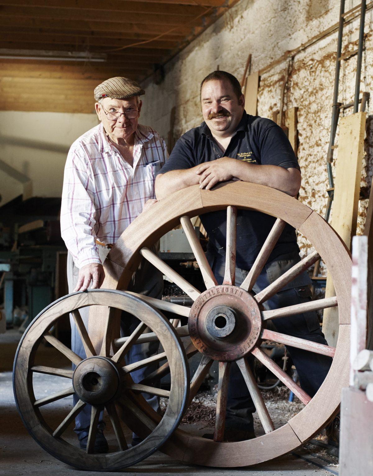 Father and son Mike and Greg Rowland build coaches and cartwheels. The trades have been in their family since 1330. (Rankin Studios)
