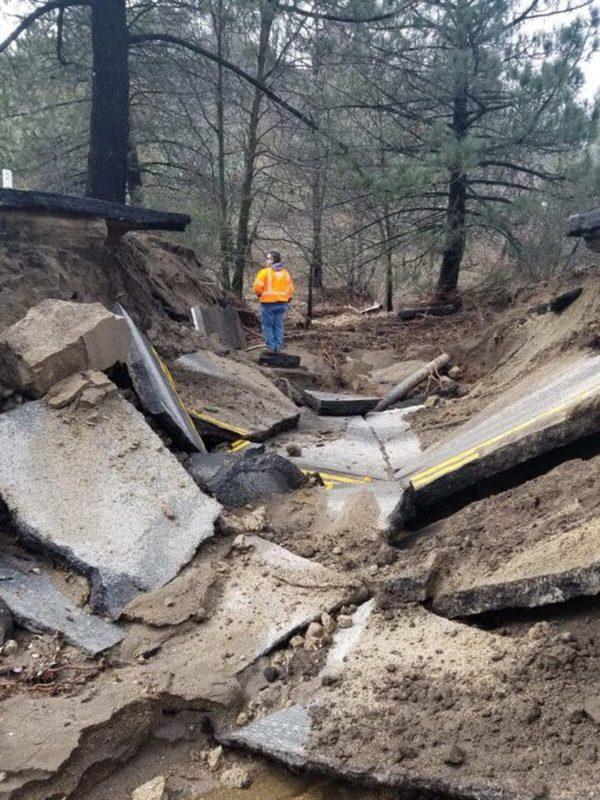 This Friday, Feb. 15, 2019, photo released by Caltrans District 8 shows storm damage to the San Jacinto Mountains Highway 243 near Idyllwild, Calif. (Caltrans District 8 via AP)