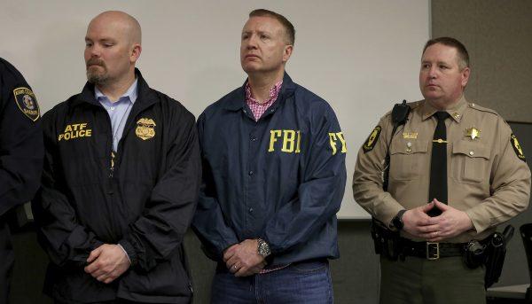Representatives of law enforcement agencies attend a news conference, in Aurora, Ill., after shootings at a manufacturing company in the city, on Feb. 15, 2019. (Patrick Kunzer/Daily Herald via AP)