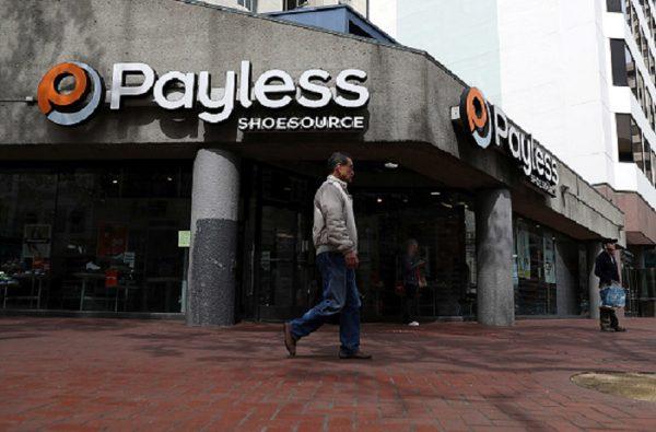 A pedestrian walks by a PaylessShoe Source store in San Francisco, California, on April 5, 2017. (Photo by Justin Sullivan/Getty Images)