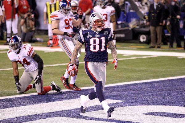 Aaron Hernandez #81 of the New England Patriots celebrates after catching a 12 yard touchdown pass from Tom Brady #12 in the third quarter against Deon Grant #34 of the New York Giants during Super Bowl XLVI at Lucas Oil Stadium in Indianapolis, Indiana, on Feb. 5, 2012. (Andy Lyons/Getty Images)