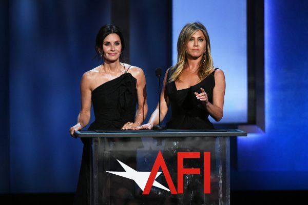 Courteney Cox (L) and Jennifer Aniston speak during the American Film Institute's 46th Life Achievement Award Gala Tribute to George Clooney at Dolby Theatre in Hollywood, Calif., on June 7, 2018. (Kevin Winter/Getty Images)