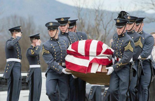 VMI cadets carry the flag-draped coffin of former Secretary of the Army John Marsh Jr. outside New Market Battlefield State Historical Park during his funeral in New Market, Va., on Feb. 15, 2019. (Rich Cooley/Northern Virginia Daily via AP)
