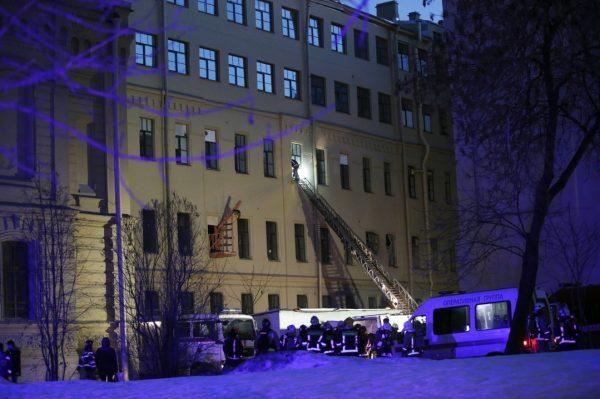 Russian Emergency employees work at the scene of the collapse building of the Saint Petersburg National Research University of Information Technologies, Mechanics and Optics in St. Petersburg, Russia, on Feb. 16, 2019. (AP Photo/Dmitri Lovetsky)