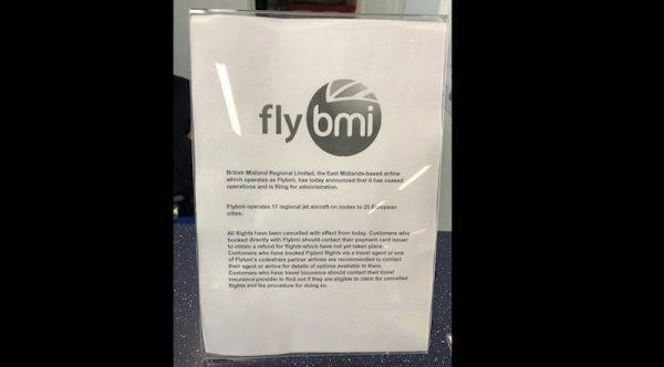 A notice informing passengers that flybmi flights have been cancelled following the collapse of the airline, at Bristol Airport in Bristol, England, on Feb. 17, 2019. (PA via AP)