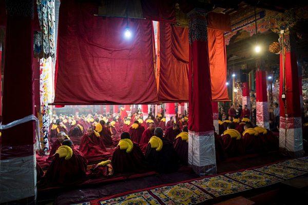 Monks sitting and praying in the Buddhist Sera monastery in the regional capital Lhasa, Tibet, on September 11, 2016. (JOHANNES EISELE/AFP/Getty Images)