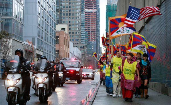Protestors march towards the Chinese consulate while voicing their support for Tibetan independence in New York City on December 10, 2008. (Photo by Mario Tama/Getty Images)