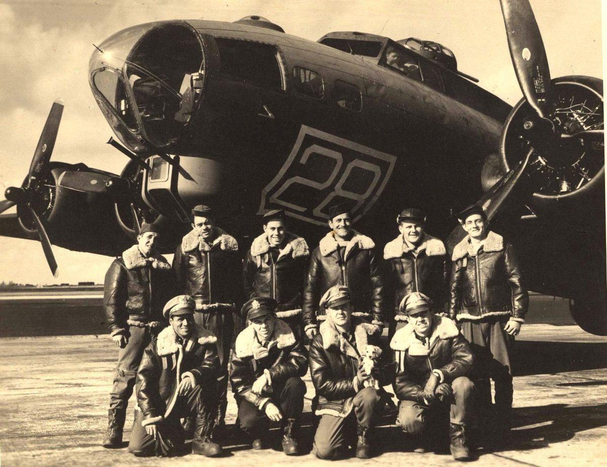 The crew posing for a photo in front of a training plane in Geiger Field in Spokane, Washington on Oct. 22, 1943 (The Kriegshauser family via AP)
