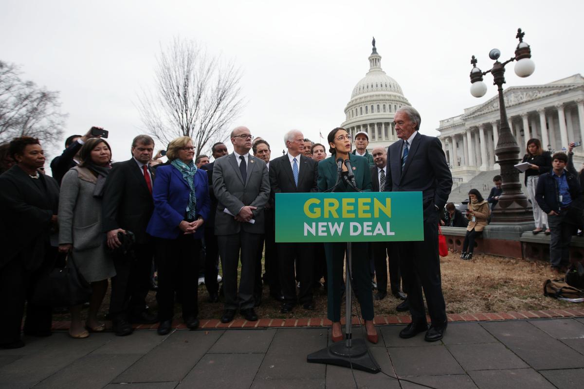U.S. Rep. Alexandria Ocasio-Cortez (D-N.Y.) speaks as Sen. Ed Markey (D-Mass.) (R) and other Congressional Democrats listen during a news conference in front of the U.S. Capitol in Washington on Feb. 7, 2019. (Alex Wong/Getty Images)