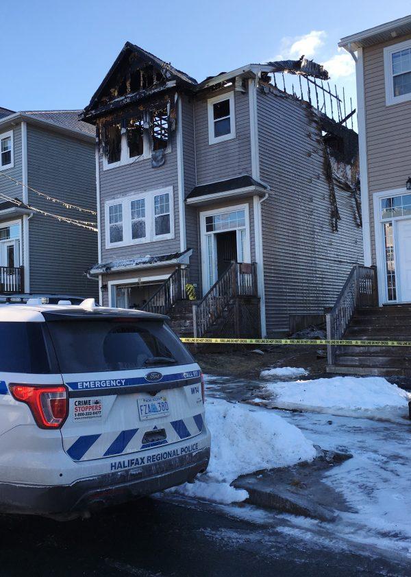 The aftermath of a house fire is seen in the Spryfield community in Halifax on Feb. 19, 2019. Police say firefighters were called to the home around 1 a.m. (The Canadian Press/Rob Roberts)