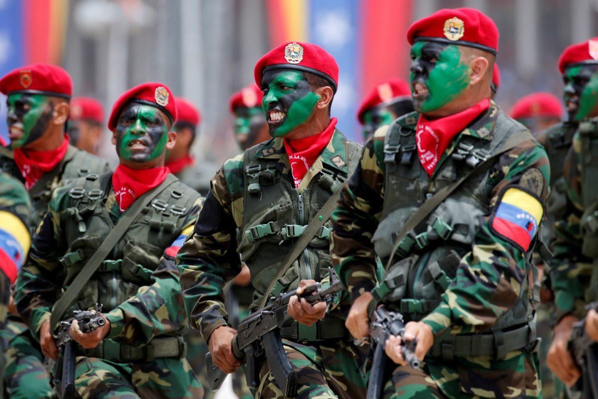 Venezuelan soldiers with their faces painted march during a military parade to celebrate the 205th anniversary of Venezuela's independence in Caracas, Venezuela July 5, 2016. (REUTERS/Carlos Jasso)