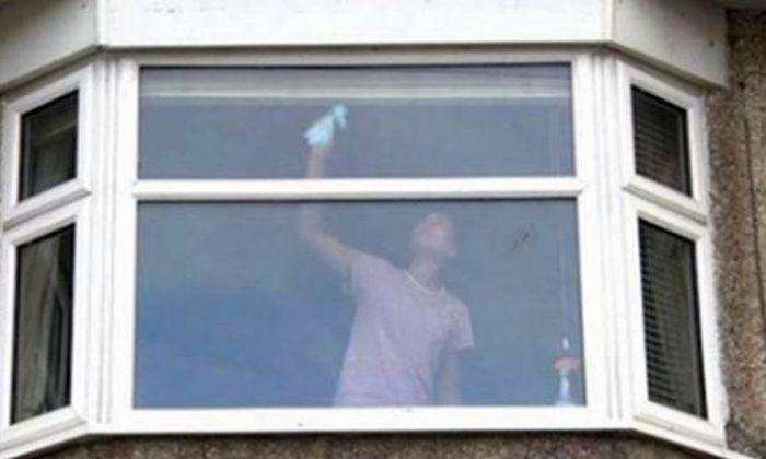 UK Cops Post Photo of Woman Cleaning Windows as a Warning