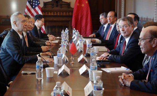 (R-L) Commerce Secretary Wilbur Ross, U.S. Trade Representative Robert Lighthizer and other Trump Administration officials sit down with Chinese Vice Premier Liu He (L), Central Bank Governor Yi Gang (2nd L) and other Chinese vice ministers and senior officials for negotiations in the Diplomatic Room at the Eisenhower Executive Office Building in Washington, D.C. on Jan. 30, 2019. (Chip Somodevilla/Getty Images)