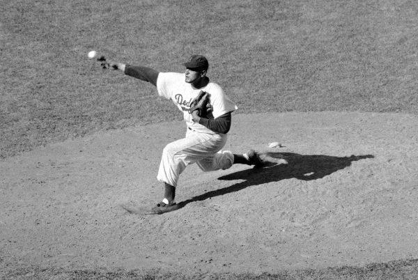Brooklyn Dodgers pitcher Don Newcombe throws against the St. Louis Cardinals at Ebbets Field in N.Y., on Sept. 19, 1956. (Photo/AP)