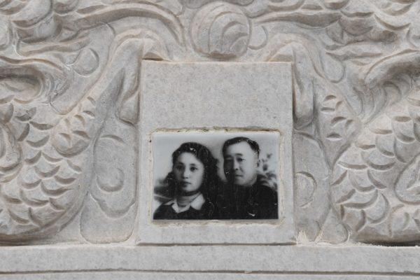 A photo of a couple is seen on a gravestone during the Qing Ming festival, also known as Tomb Sweeping Day, at a cemetery in Beijing on April 5, 2018. (Greg Baker/AFP/Getty Images)