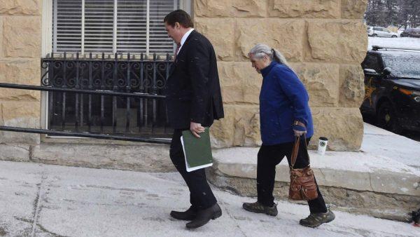 Patrick Frazee's mother, Sheila Frazee, right, heads up the hill to the Teller County Courthouse in Cripple Creek, Colo., on Feb. 19, 2019. (Jerilee Bennett/The Gazette via AP)