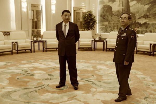 Chinese leader Xi Jinping (L) and General Fang Fenghui, chief of the general staff of the Chinese People's Liberation Army, wait to meet General Joseph Dunford, the chairman of the US joint chiefs of staff, at the Great Hall of the People in Beijing on Aug. 17, 2017. (Andy Wong/AFP/Getty Images)