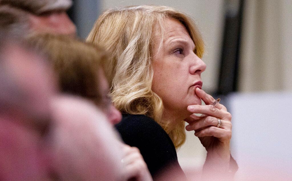 Beth Harris, the wife of Mark Harris, a Republican candidate in North Carolina's 9th Congressional race, listens to testimony during the third day of a public evidentiary hearing on the 9th Congressional District voting irregularities investigation Wednesday, Feb. 20, 2019, at the North Carolina State Bar in Raleigh, N.C. (Travis Long//The News & Observer/AP/Pool)