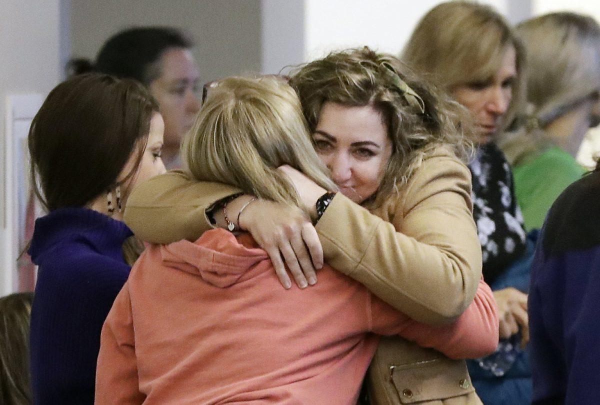 RaDonda Vaught, center, is hugged by a supporter outside a courtroom before Vaught's hearing in Nashville, Tenn. on Feb. 20, 2019. (Mark Humphrey/AP Photo)