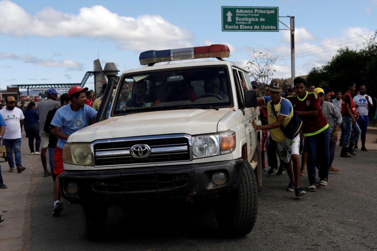 An ambulance carrying people that were injured during clashes in the southern Venezuelan town of Kumarakapay, near the border with Brazil, on Feb. 22, 2019. (Reuters/Ricardo Moraes)