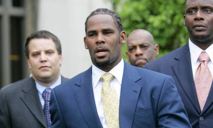R Kelly Charged With 10 Counts of Aggravated Sexual Abuse