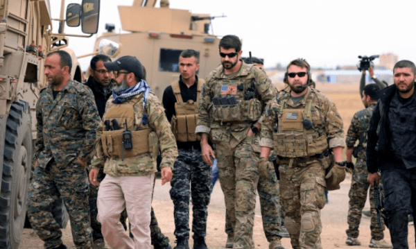 Syrian Democratic Forces and U.S. troops are seen during a patrol near Turkish border in Hasakah, Syria, on Nov. 4, 2018. (Rodi Said/Reuters)