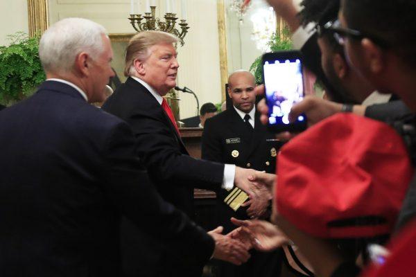President Donald Trump and Vice President Mike Pence greet invited guests during a National African American History Month reception in the East Room of the White House in Washington, on Feb. 21, 2019. (Manuel Balce Ceneta/AP Photo)