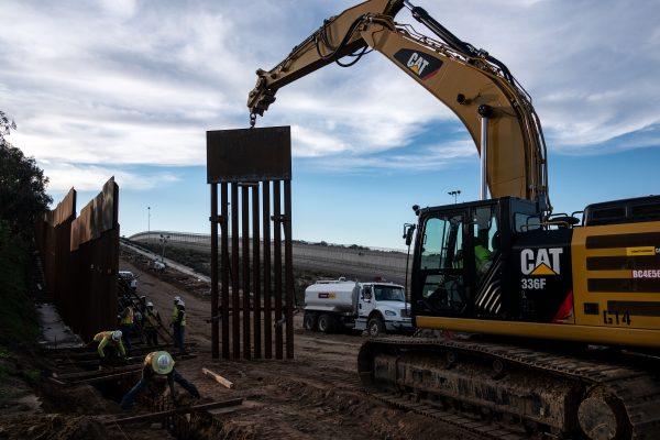 A construction crew works on replacing the U.S.-Mexico border fence as seen from Tijuana, in Baja California state, Mexico, on Jan. 9, 2019. (Guillermo Arias/AFP/Getty Images)